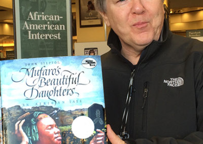 John holding one of his first book-jackets lettering projects spotted in Barnes and Noble